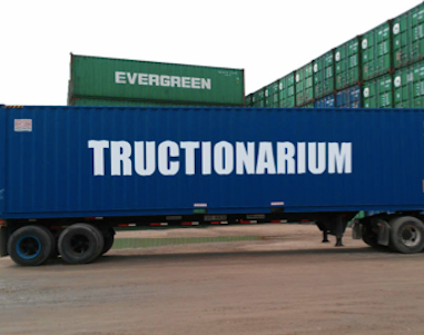 Container ship with the word Tructionarium written down the side