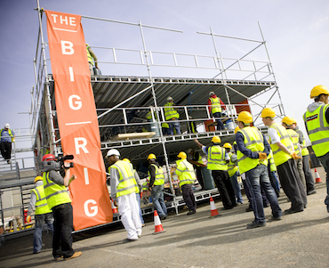 Image showing students working on the Big Rig, a pop-up education space created within a three-storey scaffolding frame